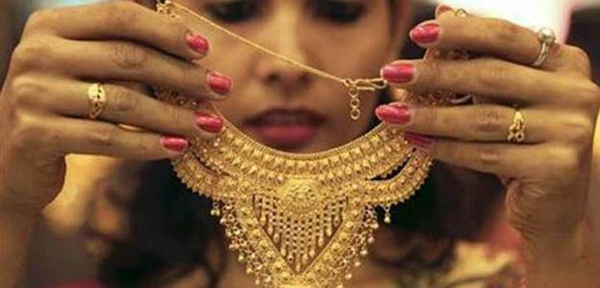 Gold, silver extend losses on weak global cues, low demand